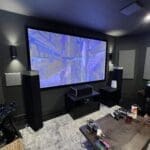 A large screen tv in the middle of a room.