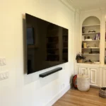 A flat screen tv mounted to the wall.