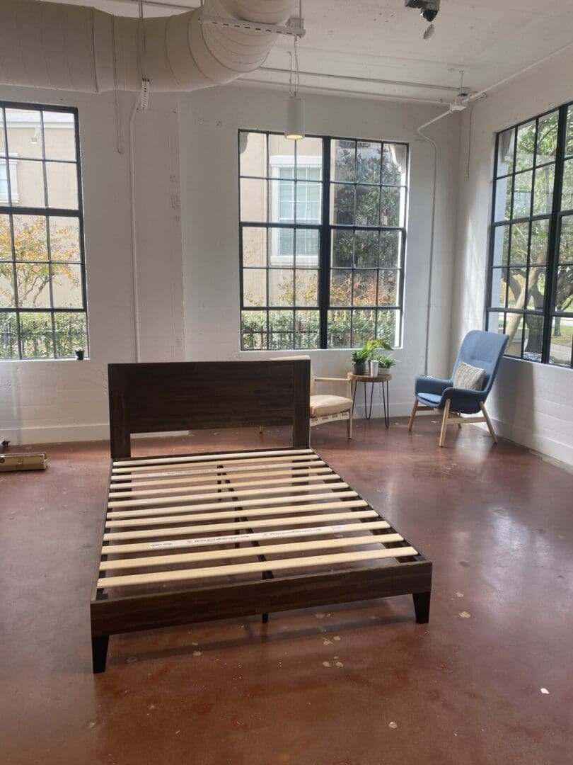 Bright, neatly arranged bedroom with natural light, demonstrating our attention to detail in furniture assembly and window treatment services.