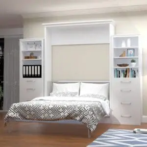 A modern room with white interiors and a white bed with cabinets on both sides
