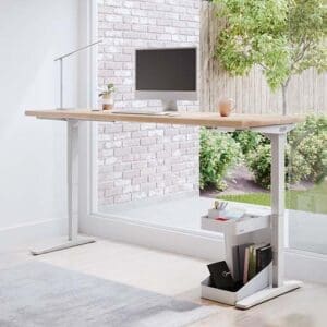 A height adjustable desk with a computer on top of it