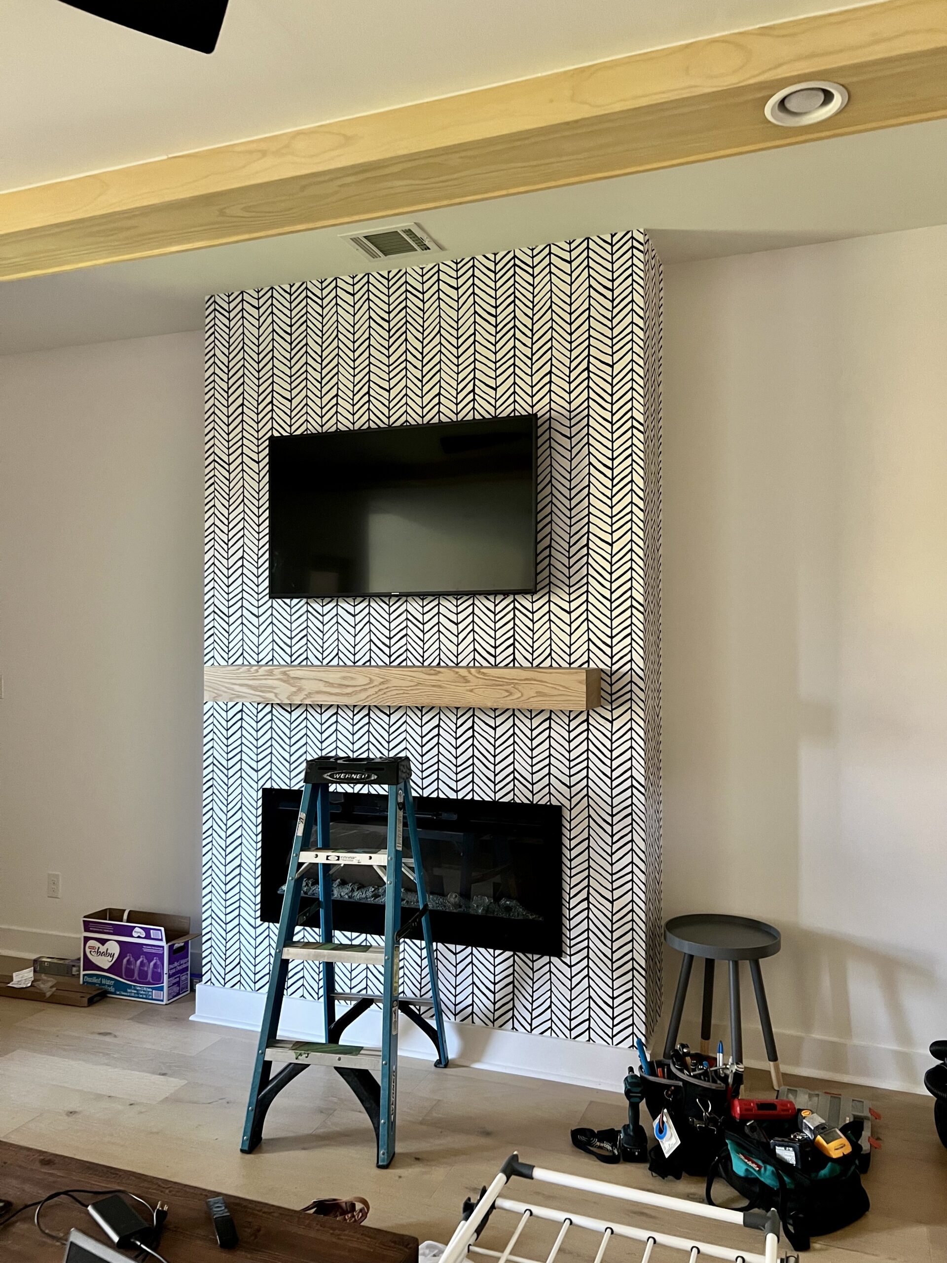 TV installation above a fireplace, ideal for maximizing space in Houston living rooms with professional mounting services.