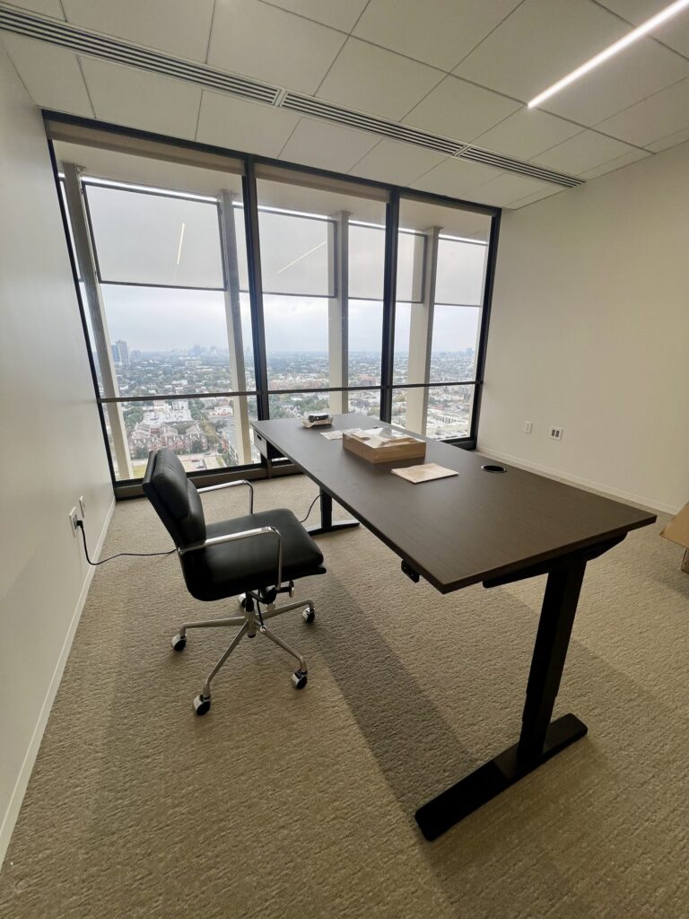 Electric standing desk assembly services in Houston for a modern workspace.